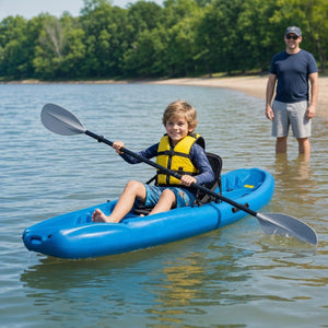 Child in a life jacket paddling the blue kids kayak