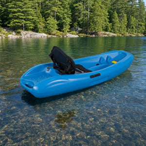 Kids kayak on a calm lake