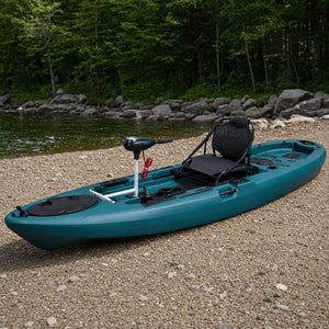 Motor-ready fishing kayak at the shoreline