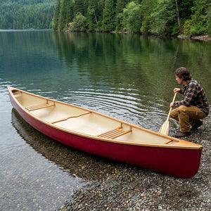 Classic red canoe at the shore